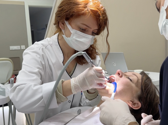 Dentist Giving a Dental Treatment to a Patient