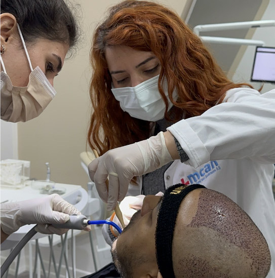 a person getting dental treatment from mcan dental in turkey